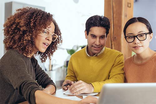 Three professionals working together