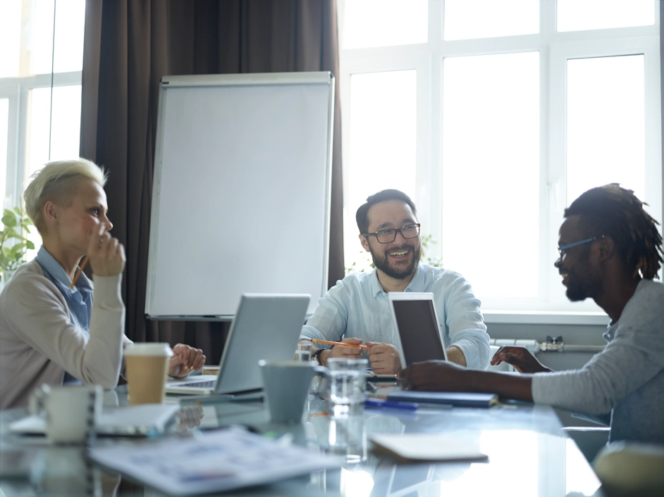 Three people in a business meeting