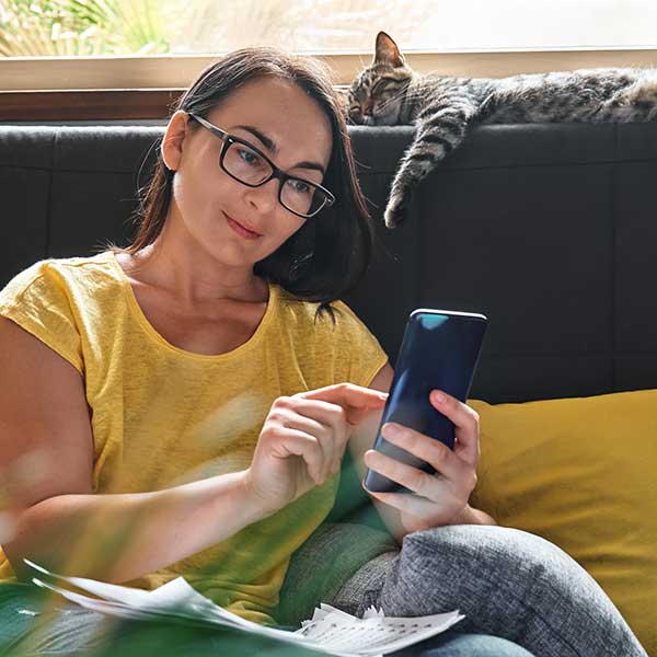 Woman banking on her mobile phone