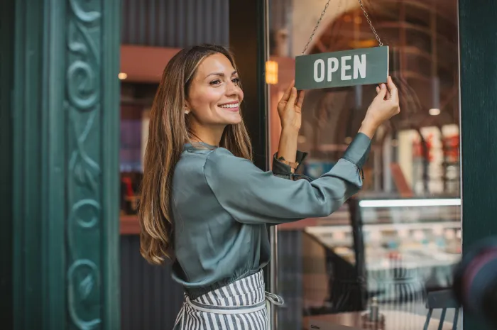 Small business owner opening up their shop for the day